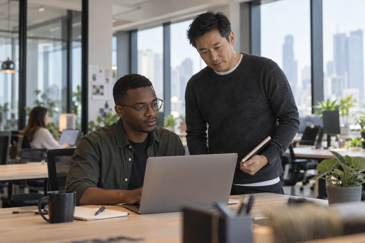 Technology professionals reviewing a product in a contemporary workspace.